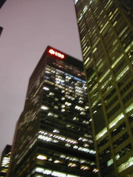 a building with lights shining down the side and below