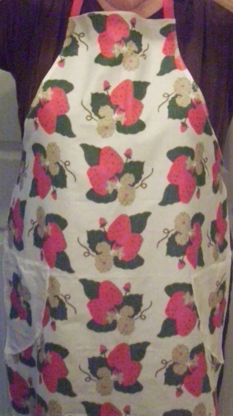 the apron is covered by a pretty flower pattern