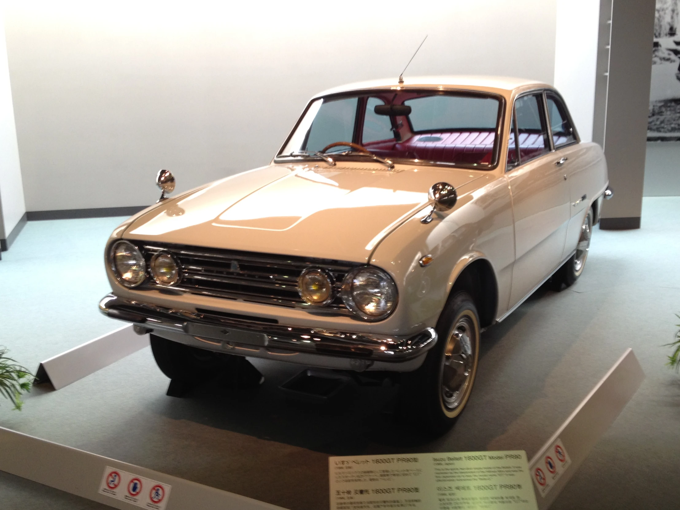 an older model car in a display case