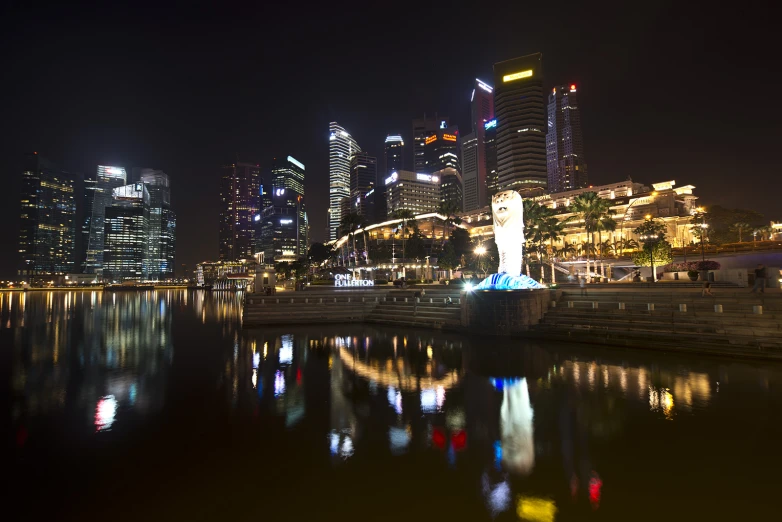 the lights on the buildings glow in the water