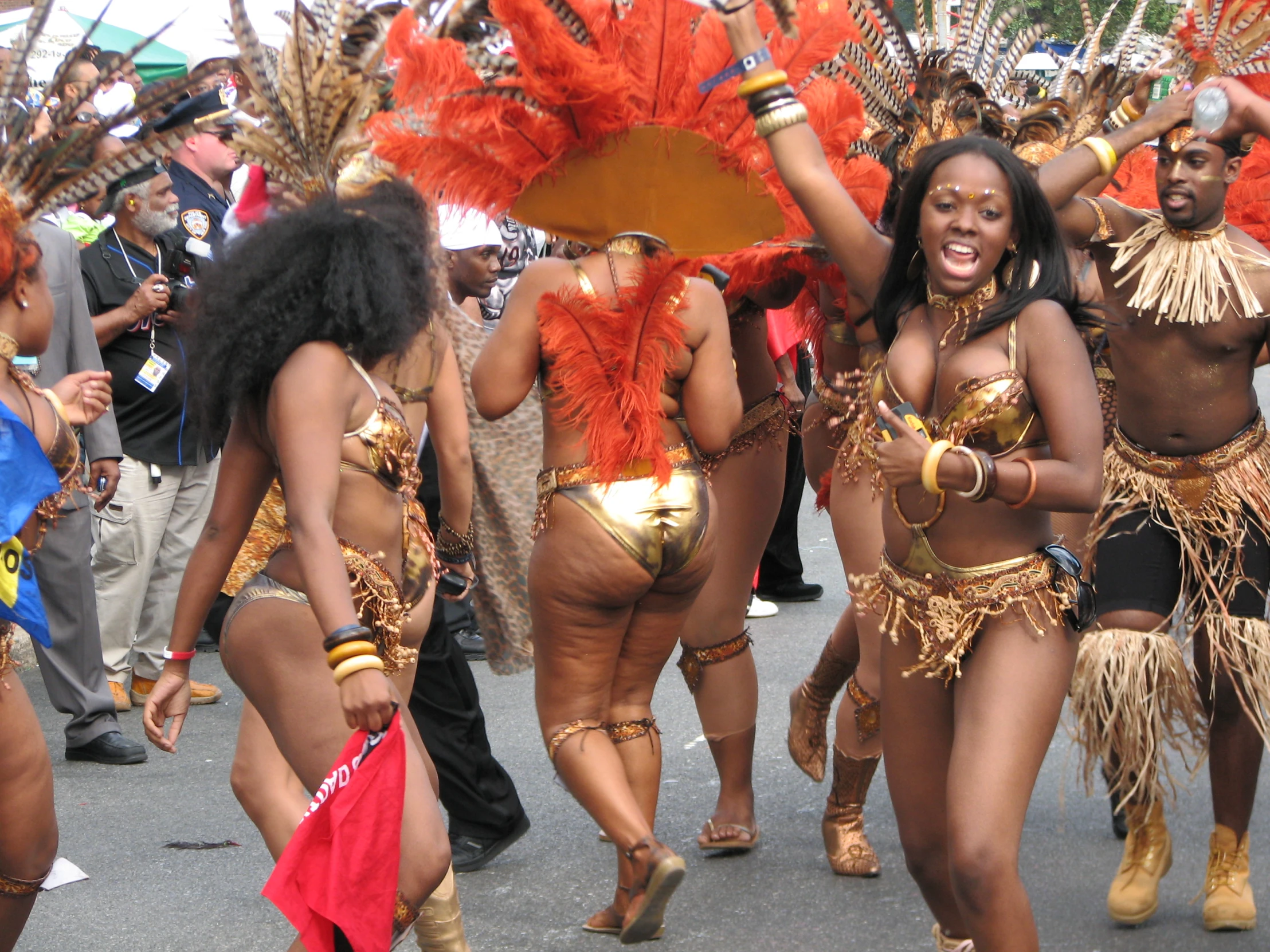 several dancers dressed in elaborate clothing are holding umbrellas