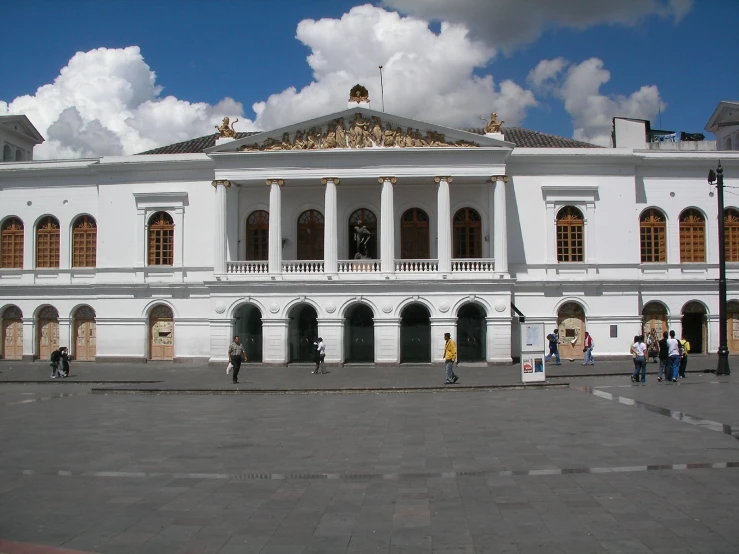 the building has a large column and pillars at its front entrance