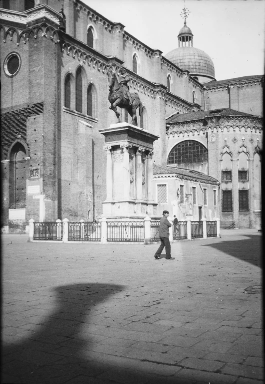 a building with statues outside on the ground