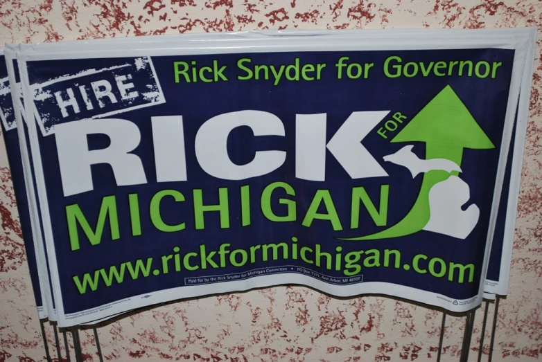 a political sign advertises rick for michigan