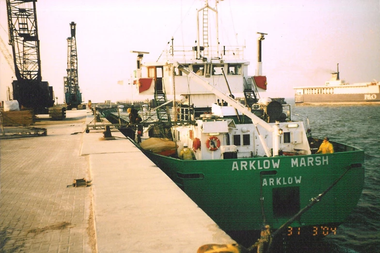 a tug boat pulled up to the dock