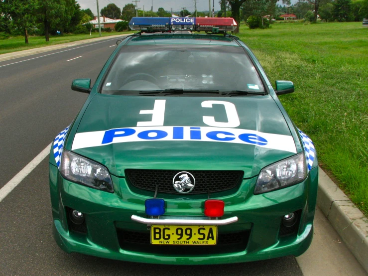 a police car sits parked in a parking lot