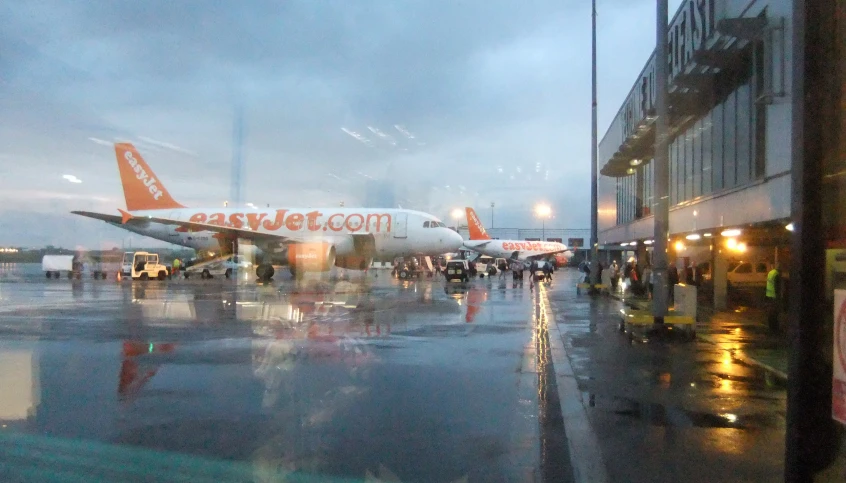 a passenger jet airplane is shown sitting on the tarmac