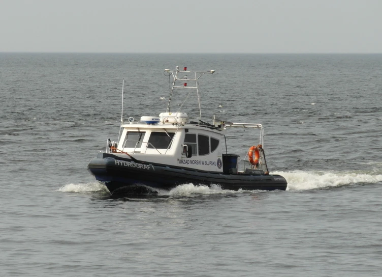 small boat traveling on the open water