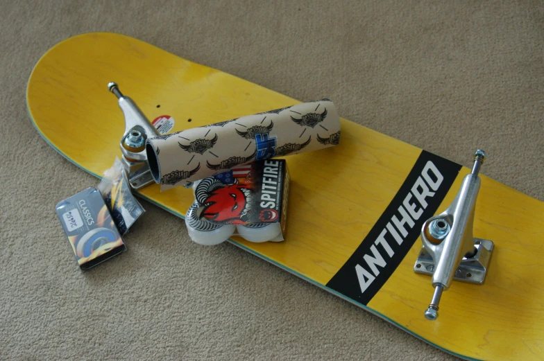 a skate board with an assortment of products attached to it
