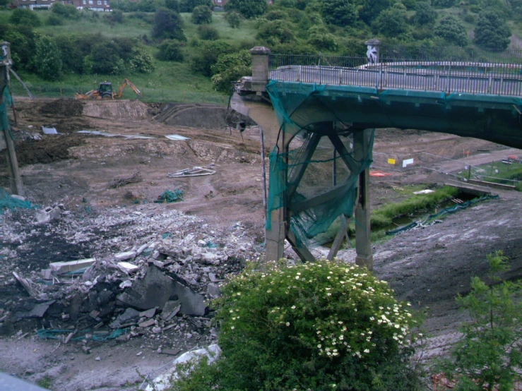 an older bridge has been damaged by a demolished pile of rubble