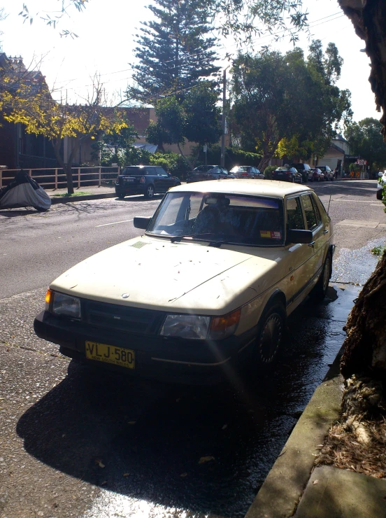 a yellow car is parked in a lot