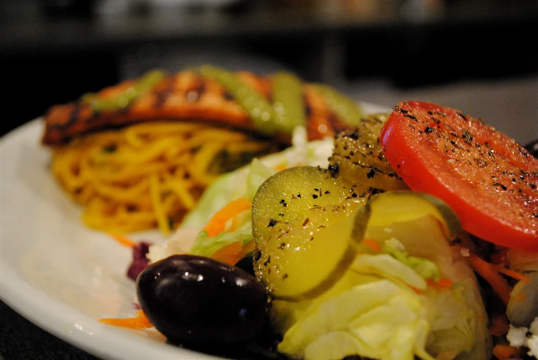 a plate with different salads and vegetables on it