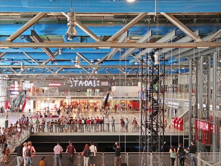 a group of people standing around and looking at the show