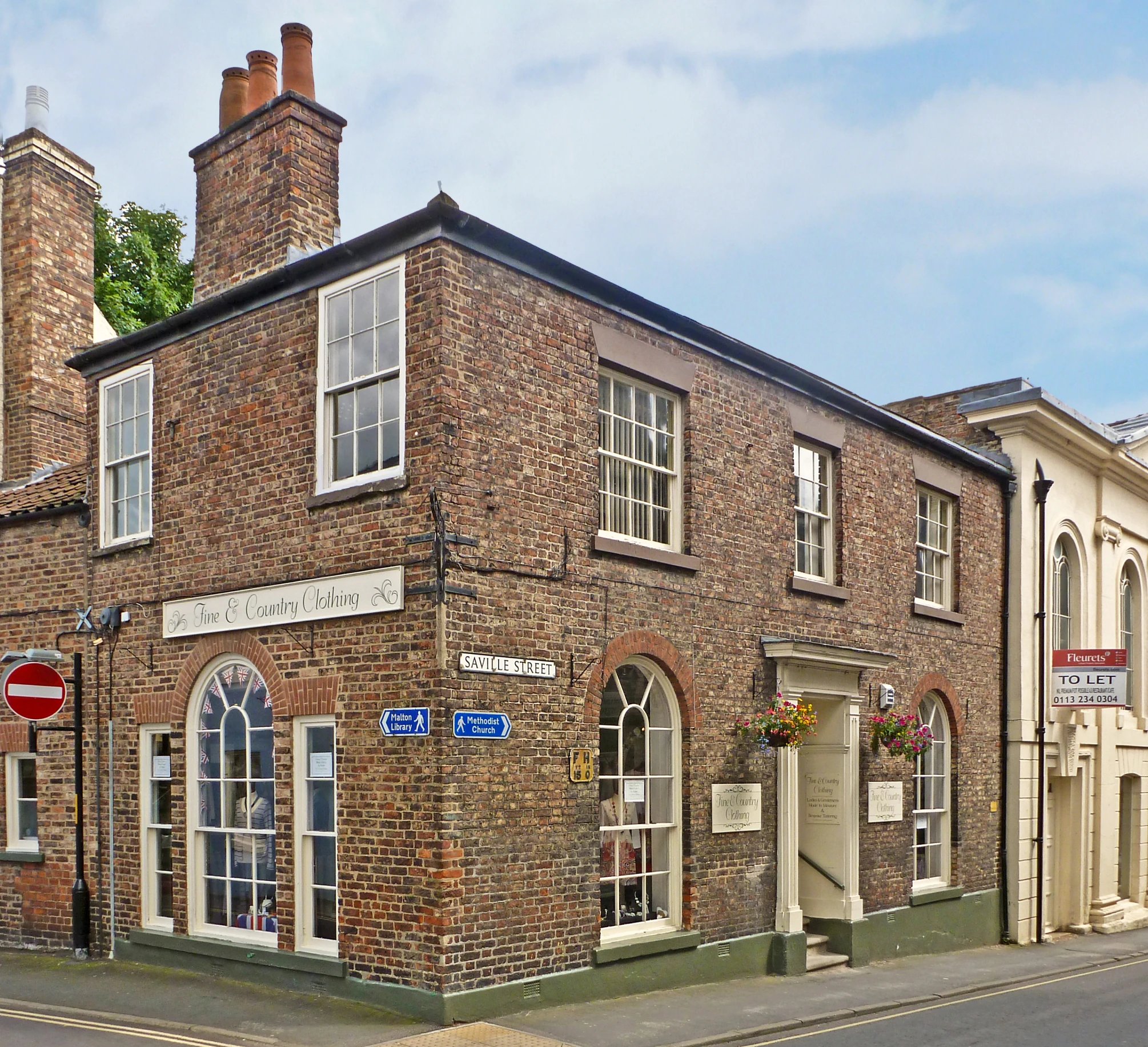 the brick building is near a small street