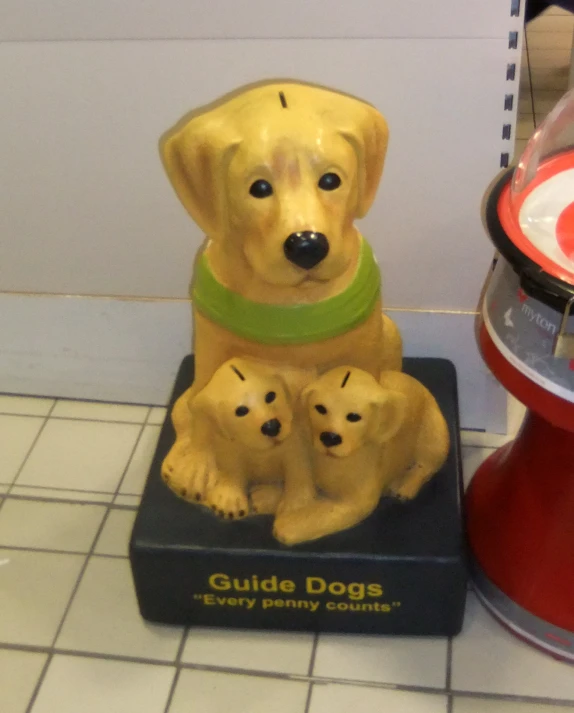a ceramic dog figurine sitting on top of a box