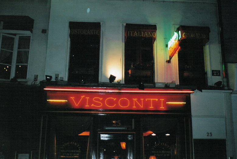 an outside of a restaurant with neon lights