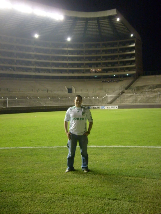 a man standing in the middle of a soccer field