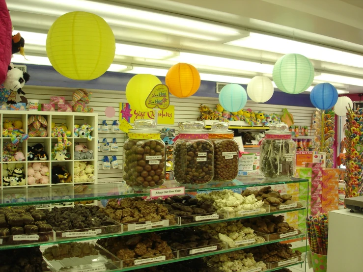 a store with a display filled with lots of desserts