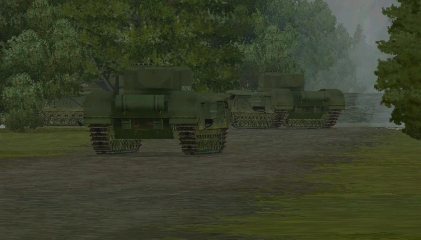 large army vehicles driving through a green field