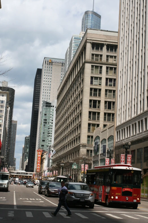 a public transit bus moving through a busy city street