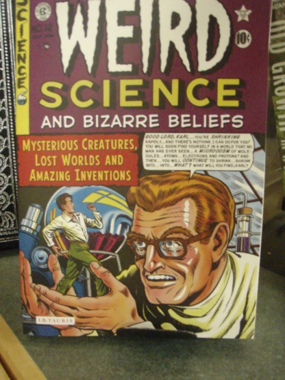 a paperback book cover showing weird science and bizarre beings
