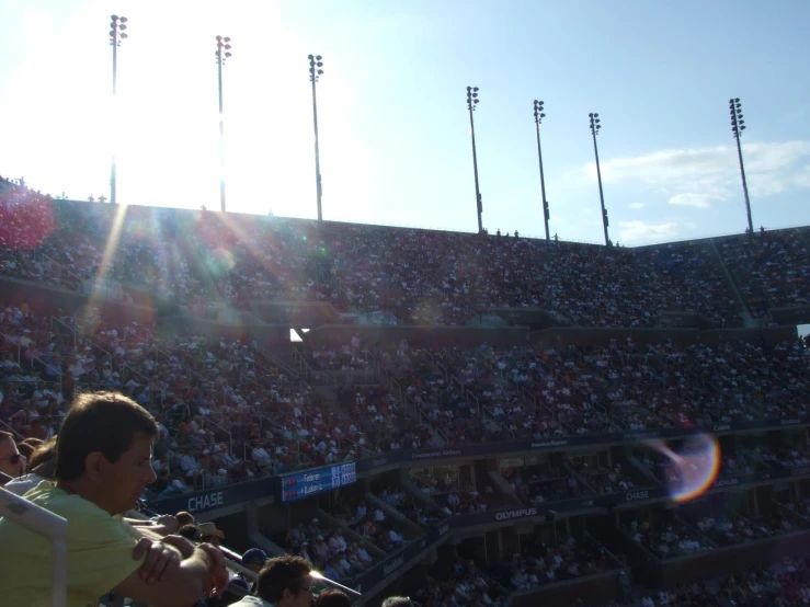 a view of a crowd at a stadium, with lots of people