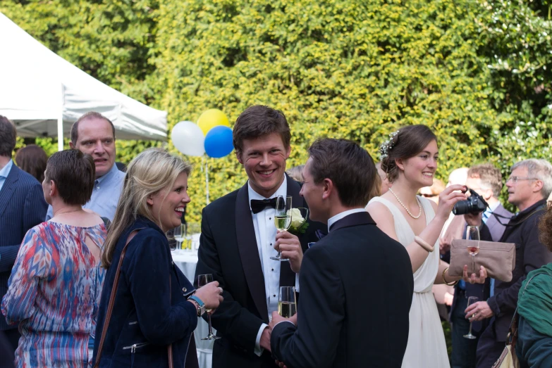 a group of friends celeting at a wedding