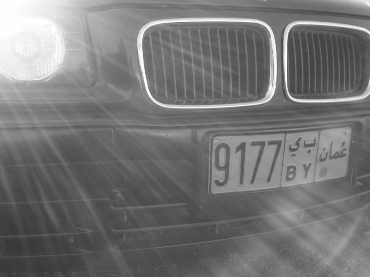 black and white pograph of front bumper of a car