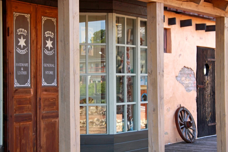 a store front sitting on top of a wooden platform