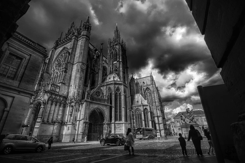 black and white po of people walking on street in a large city