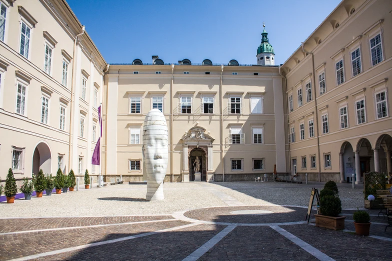 this is an inner courtyard view with buildings in the back