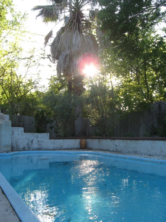 a nice outdoor swimming pool in the back yard