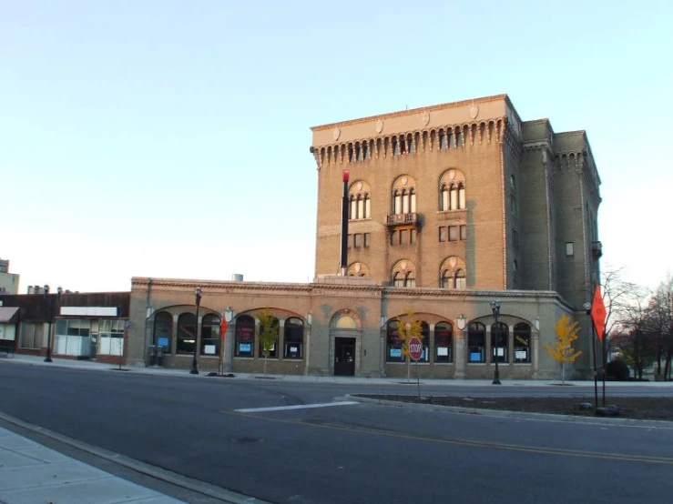 the street scene shows a large building near an empty street