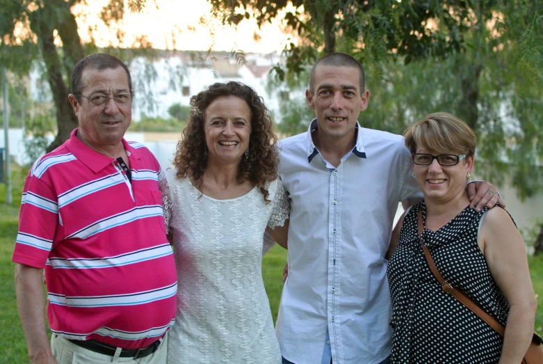 the two men and woman are smiling at a picture together