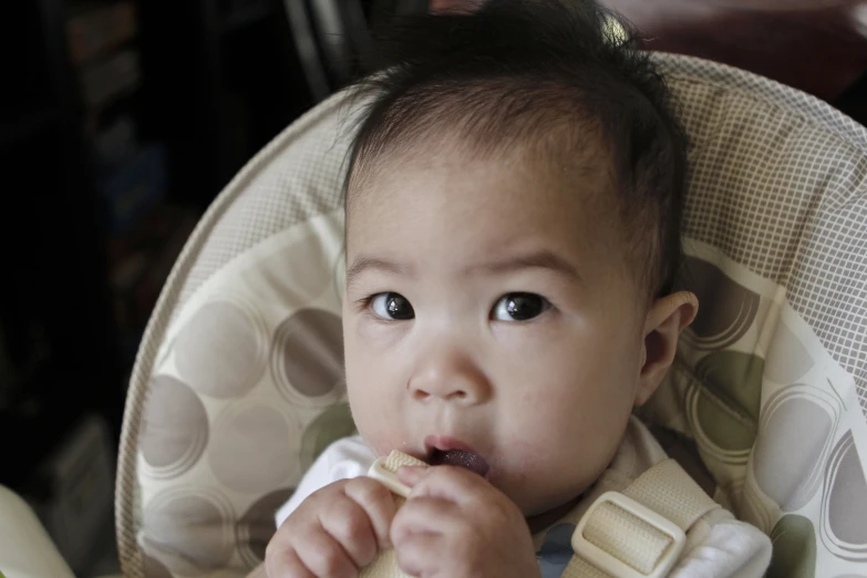 a young child eating soing with his hands