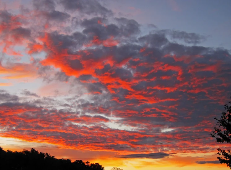 an image of red clouds in the sky at sunset