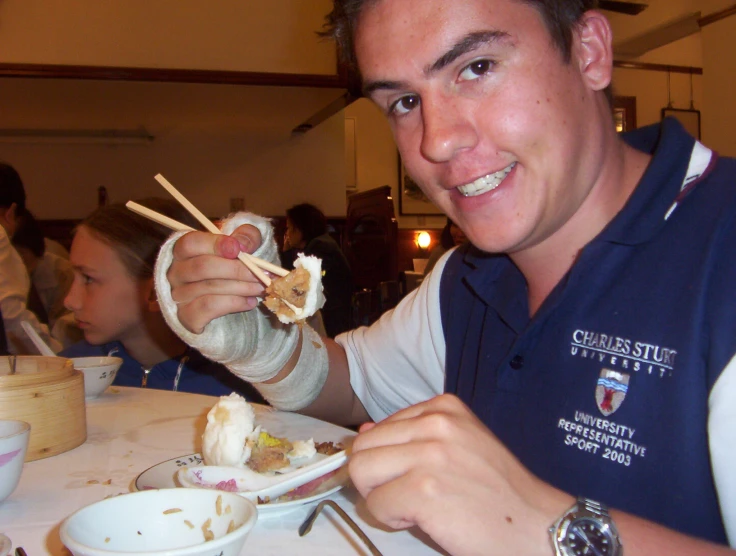 young adults eating rice cake at restaurant table