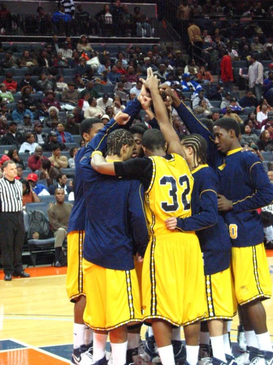 a team of men celeting on the basketball court