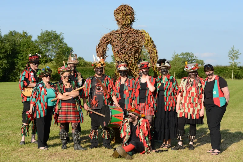 a group of people are standing around a strange person