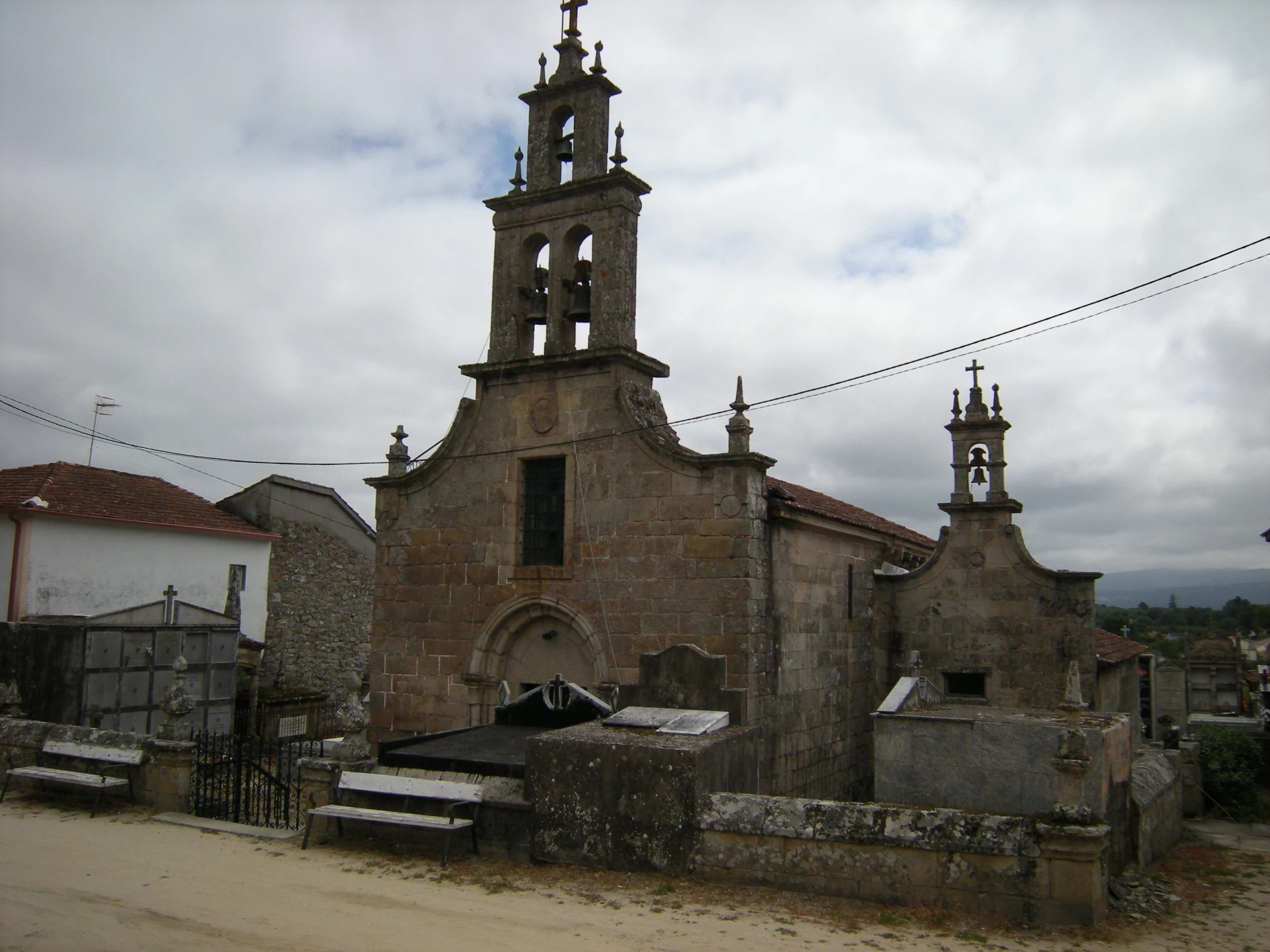 the stone building has several bells at its top