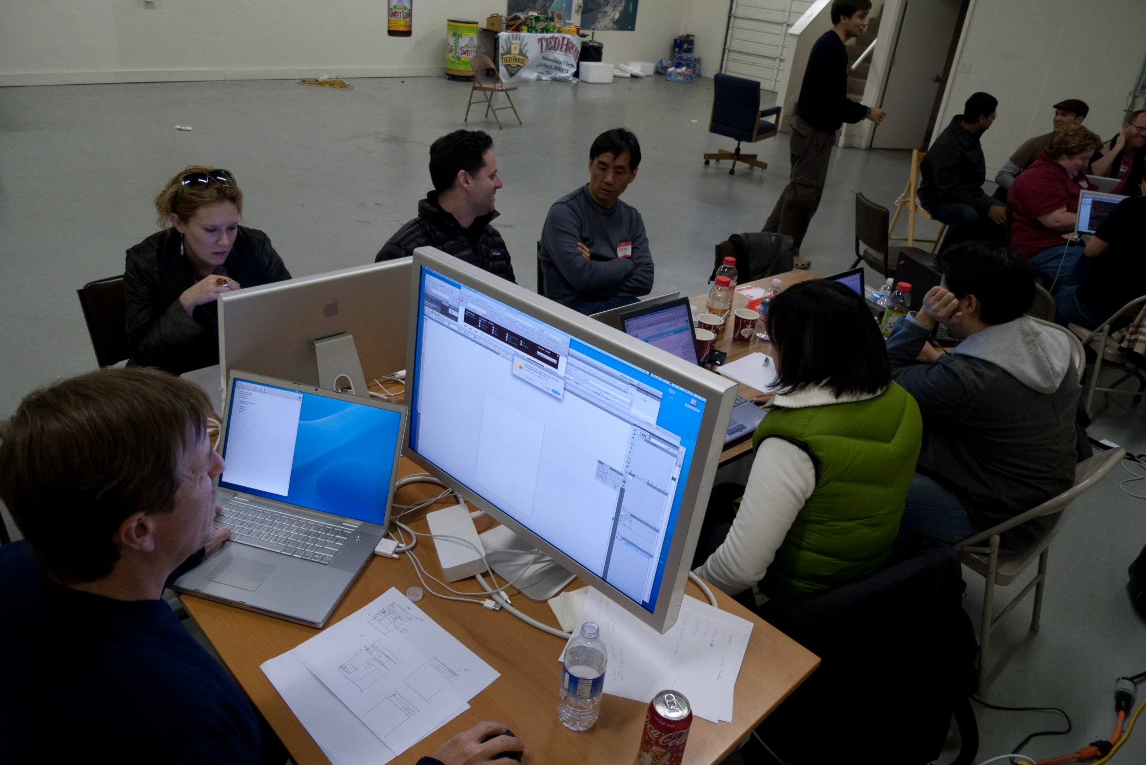 a bunch of people that are sitting in front of laptops