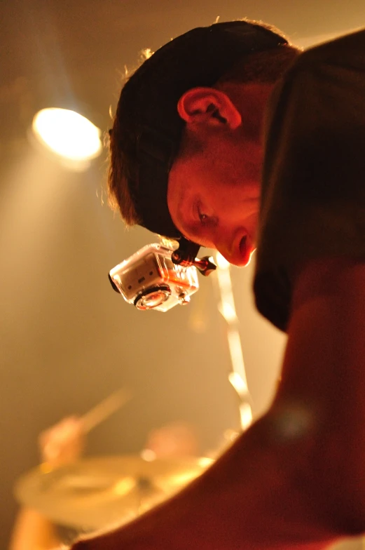 a young man drinking a glass of wine