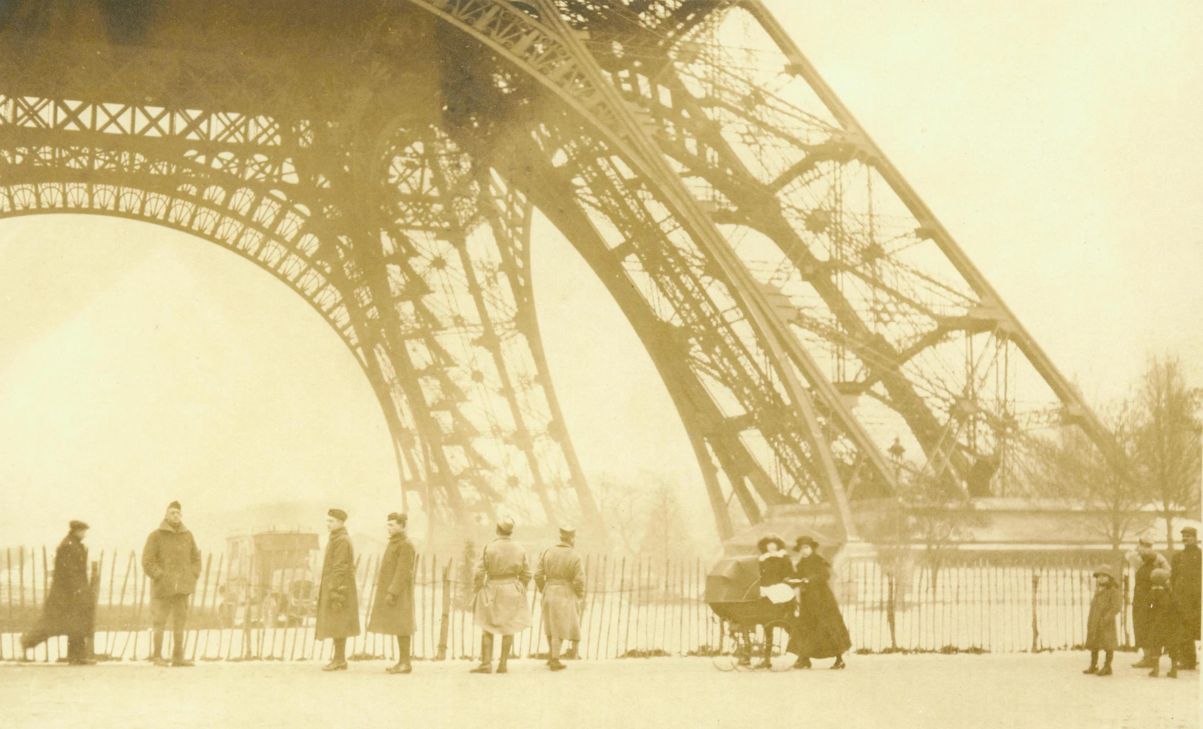 people are standing in front of the eiffel tower