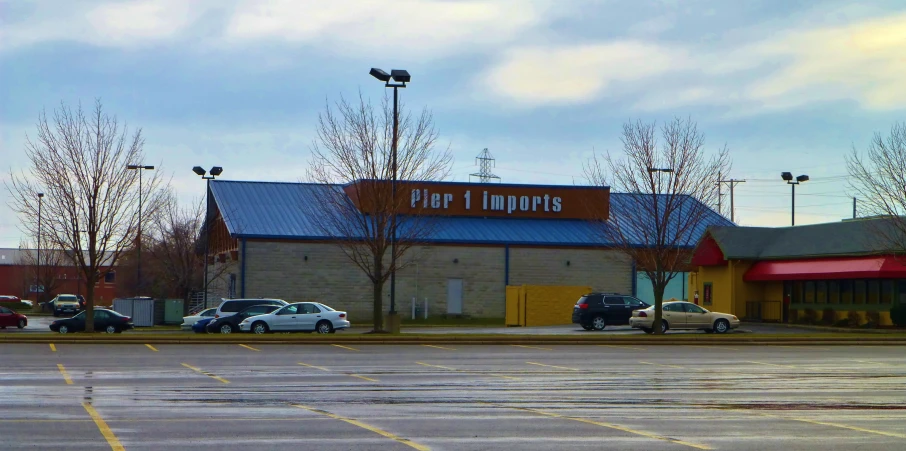 a large group of cars parked outside of a store