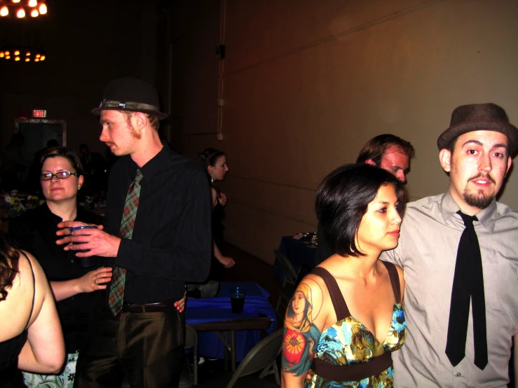 several people that are standing together at a function