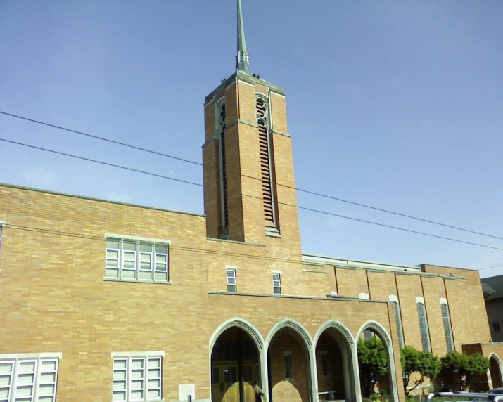 an old brown brick church with an arched doorway