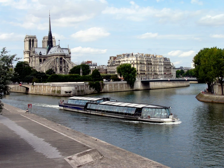 a boat on a river next to an old city