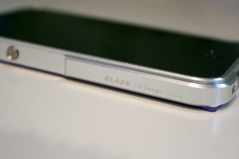 the back panel of a cell phone on a white surface
