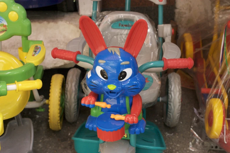 a toy figurine sits inside a store window