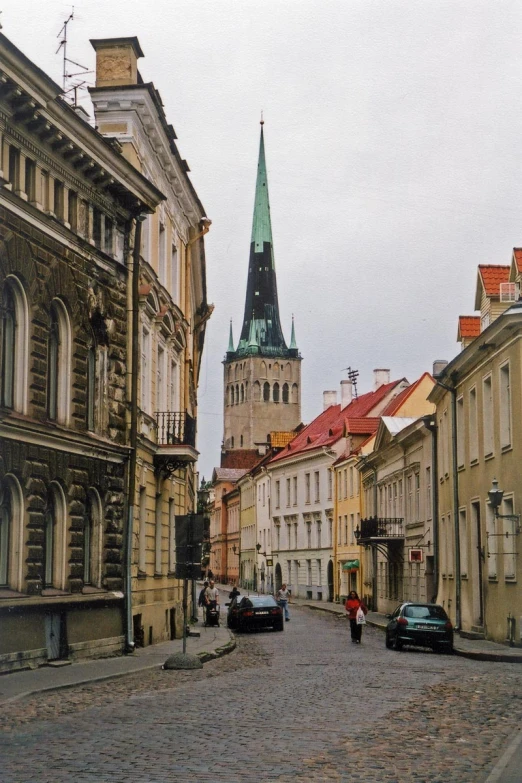 a cobblestone road in an old european city